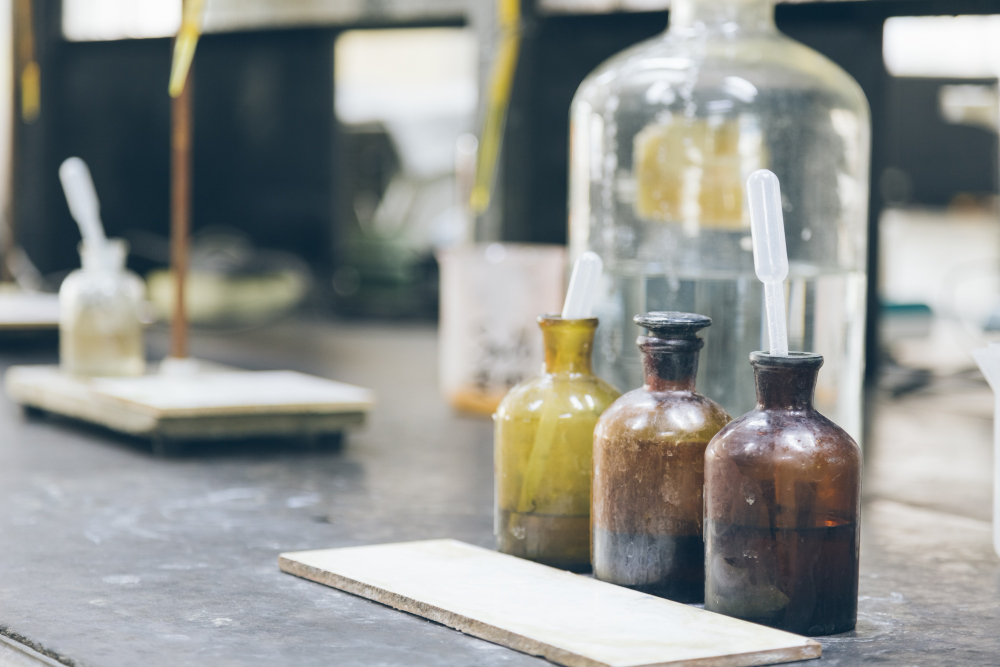 Glass chemical bottles in a laboratory representing Southern Cross Chemicals’ dependable supply and personal service in Tulsa, Oklahoma.
